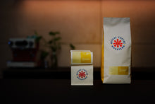 Load image into Gallery viewer, A small and large bag of the coffee side by side.