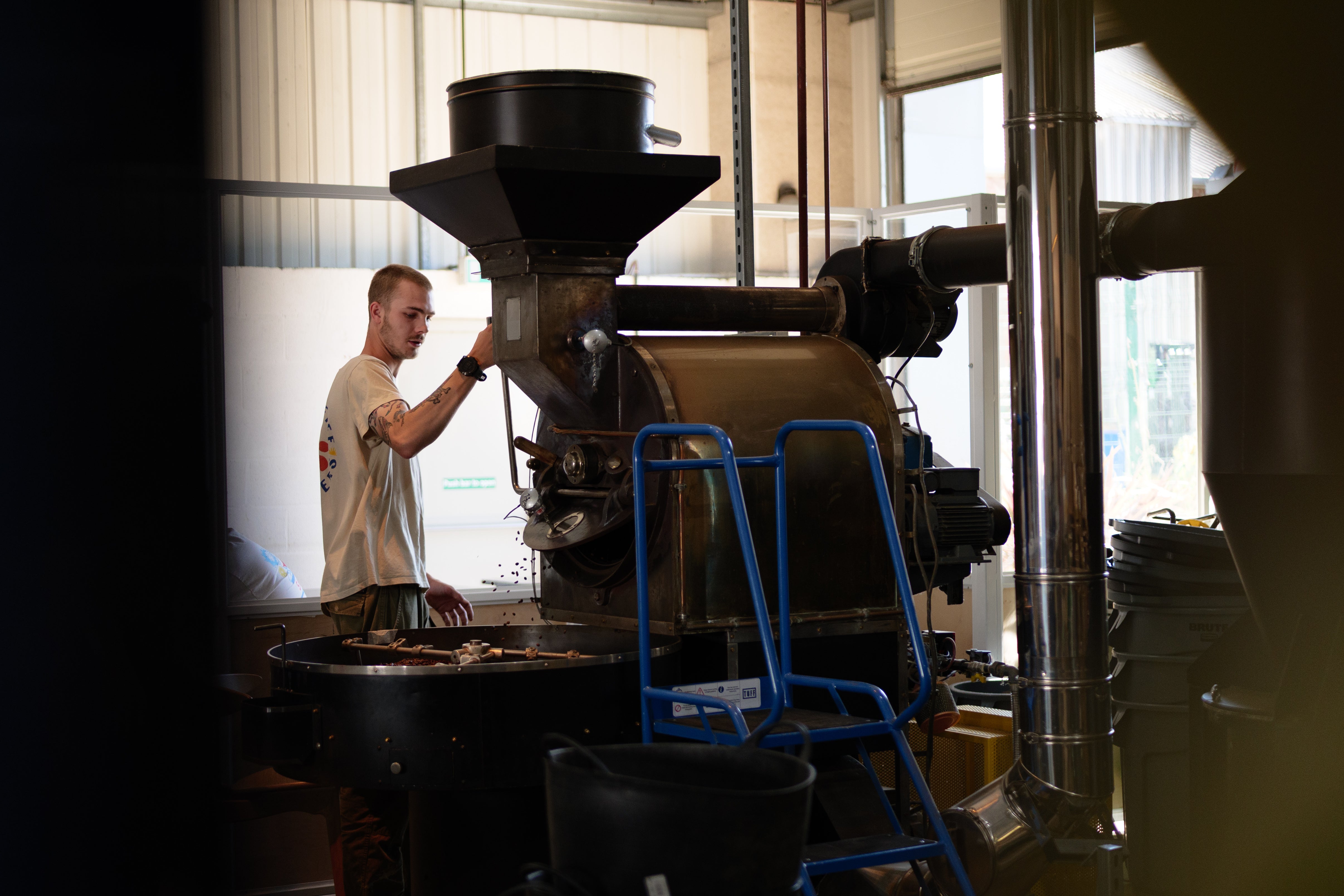 person roasting coffee beans