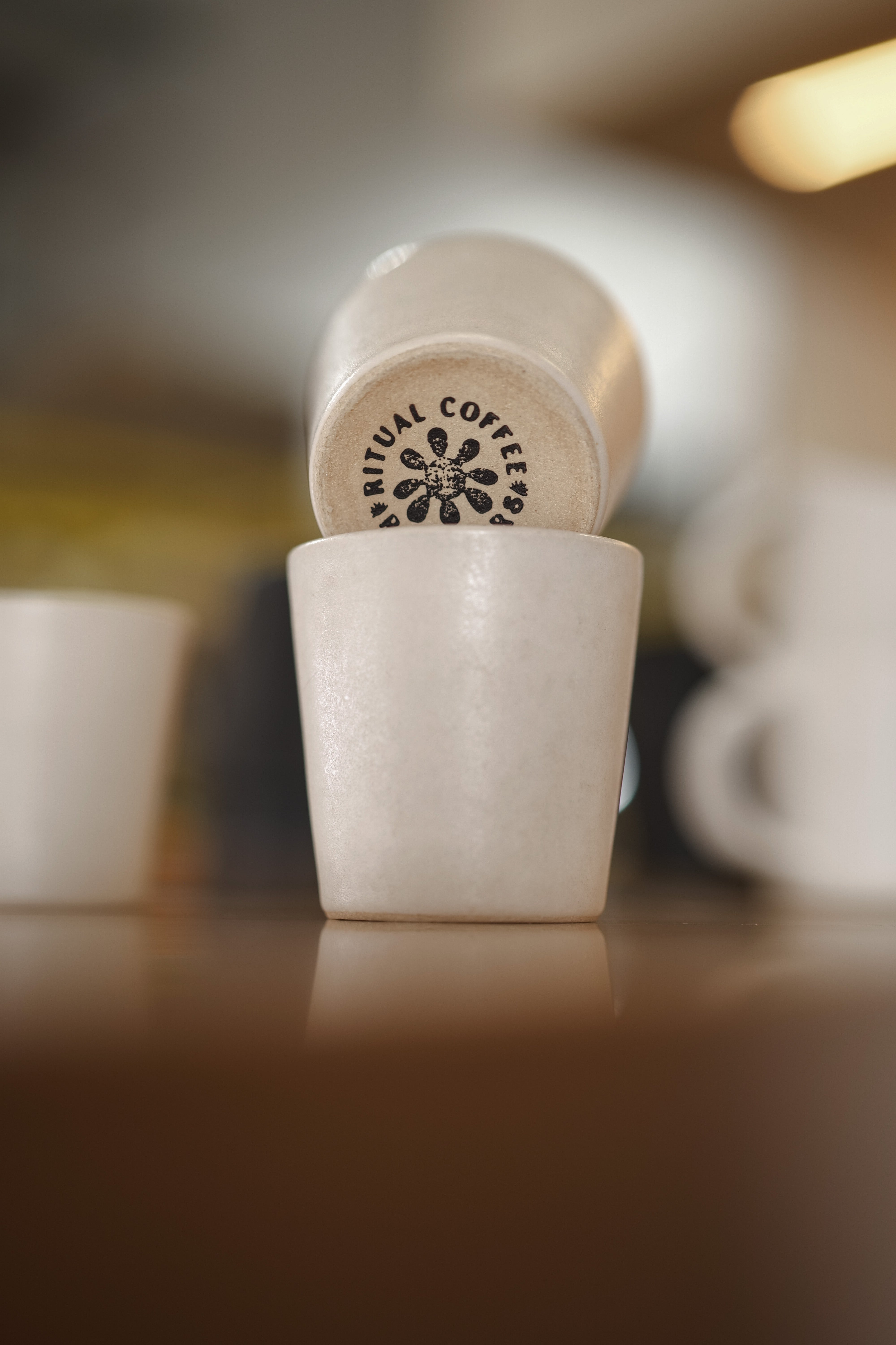 Ritual Coffee branded white cup and saucer.