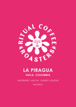 Load image into Gallery viewer, La Piragua for Espresso by Ritual Coffee Roasters – Huila, Columbia. Coffee label on a pink background with tasting notes of raspberry, melon and cherry liqueur.