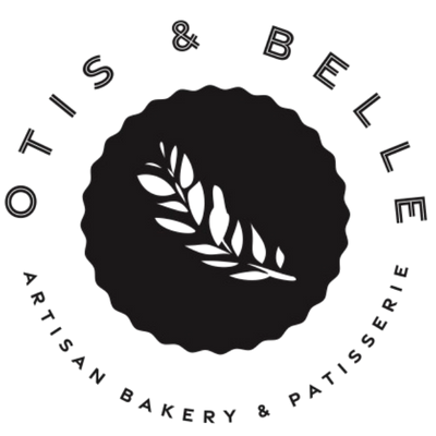 Logo of Otis & Belle Artisan Bakery & Patisserie with a black circle and white leaf design.